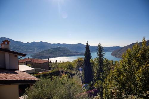 a view of a body of water from a house at Italian Vacation Homes - Lucy's House in Parzanica