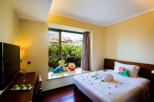 Кровать или кровати в номере Pullman Oceanview Sanya Bay Resort & Spa