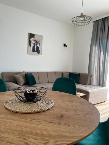 a living room with a table and a couch at Apartments HAS in Kotor