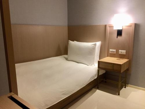 Postel nebo postele na pokoji v ubytování Jolley Hotel