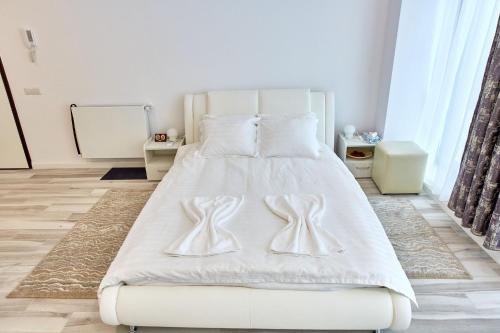 En eller flere senge i et værelse på Studio Bel Air Lotus