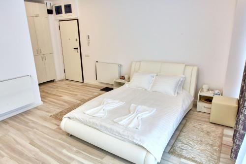 En eller flere senge i et værelse på Studio Bel Air Lotus