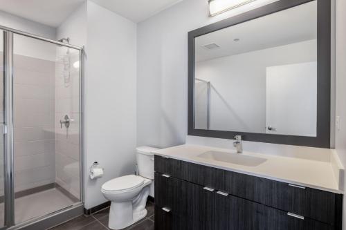 a bathroom with a toilet and a sink and a shower at South Loop 1br w gym game room nr top schools CHI-988 in Chicago