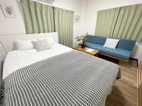 เตียงในห้องที่ M Ikebukuro Apartment 101