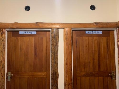 two doors in a room next to each other at Mad Vervet Nairobi Backpackers Hostel in Nairobi