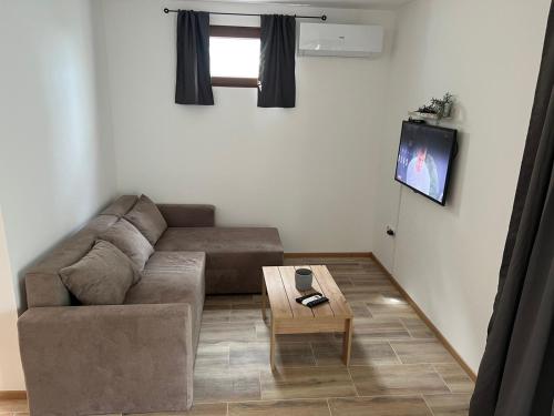 Predel za sedenje v nastanitvi Apartmani M