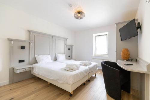 Postel nebo postele na pokoji v ubytování Hof de Draeck Apart