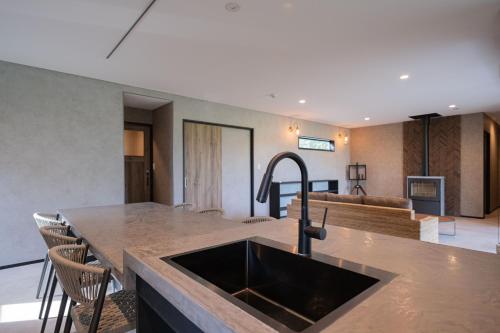 a kitchen with a sink and a counter top at VACILANDO in Fujikawaguchiko