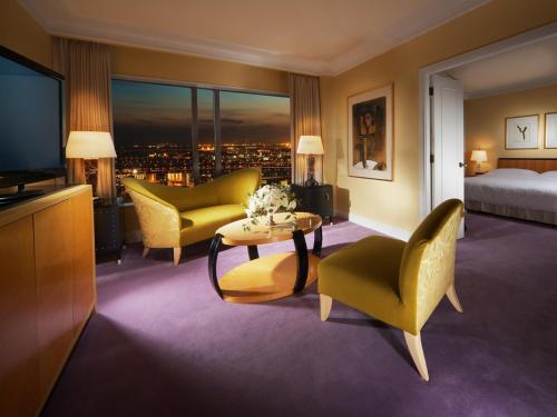 a hotel room with a bed and a television at Hotel Hankyu International in Osaka