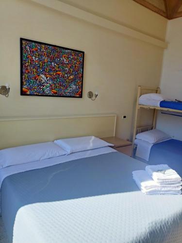 Ένα ή περισσότερα κρεβάτια σε δωμάτιο στο Hotel Serena