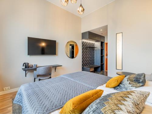 a bedroom with a king sized bed and a desk at Santa's Hotel Santa Claus in Rovaniemi