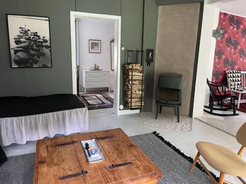 a living room with a bed and a coffee table at Kostastugan in Kosta