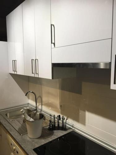 a kitchen counter with a sink and white cabinets at Casa rural en El Burguillo -Vitalia 2 CR-AV-1251 in Las Cruceras