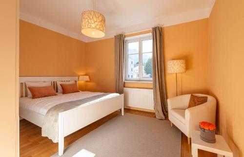 Ένα ή περισσότερα κρεβάτια σε δωμάτιο στο Apartments am Kurpark