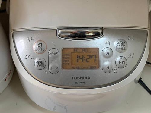 a close up of a toaster oven with a clock on it at Torinosu in Jōnouchi