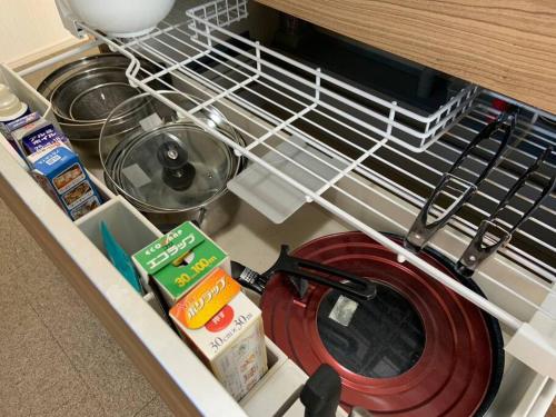 a drawer in a dishwasher filled with food and utensils at Torinosu in Jōnouchi