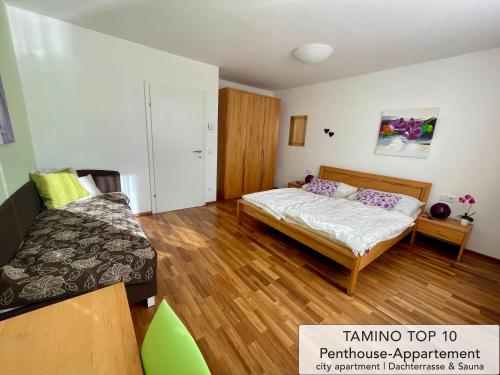 מיטה או מיטות בחדר ב-Penthouse TAMINO TOP 10