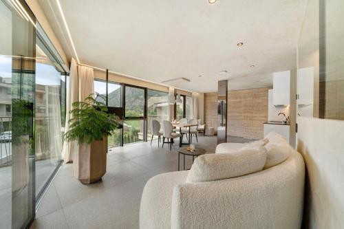 a living room with a couch and a table at Boutique Hotel AMARIL in Castelbello-ciardes