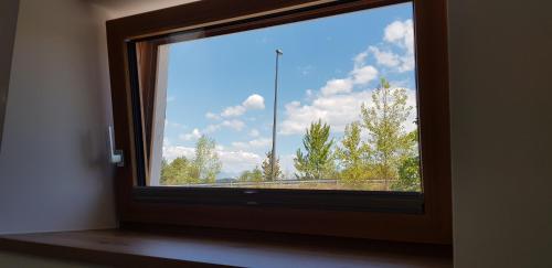 a window with a view of the sky at AppPrusnik in Ljubljana