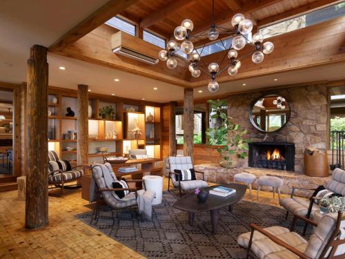 a large living room with a stone fireplace at Alila Ventana Big Sur Adult Only in Big Sur