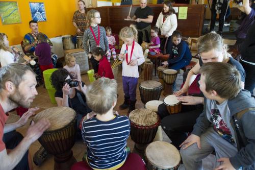 a group of children sitting around drums at Rodinný penzion Skiland in Ostružná