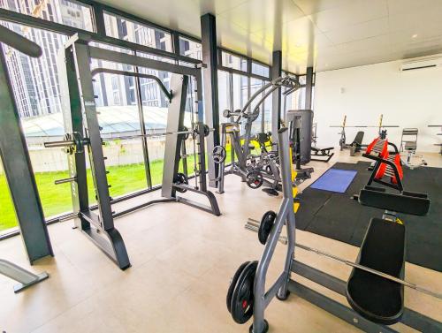 a gym with a bunch of tread machines in it at lovina 1115 at Pollux Meisterstadt in Batam Center