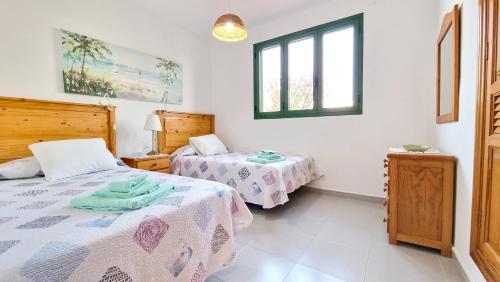 Posteľ alebo postele v izbe v ubytovaní Casa Maracuyá