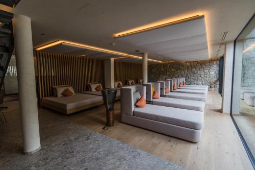 a row of couches in a waiting room at Boutique Hotel AMARIL in Castelbello-ciardes