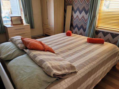 a bed with two pillows on it in a bedroom at No 27 Guisborough - 1 bed apartment in Guisborough