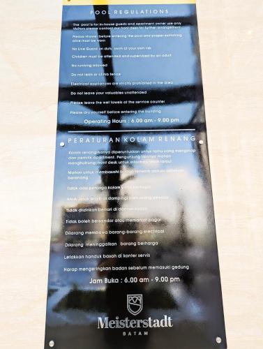 a menu for a restaurant with a picture of a ladder at Lovina 1205 at Pollux Meisterstadt in Batam Center