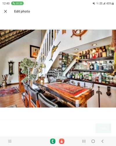 a dining room with a table and some shelves at 147@ Simon Bekker Kosmos in Hartbeespoort