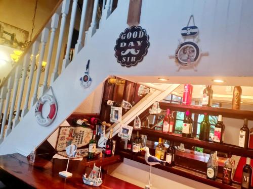 a staircase leading up to a bar in a restaurant at 147@ Simon Bekker Kosmos in Hartbeespoort