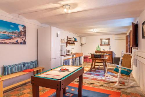 a living room with a couch and a table at S'alqueria in Sóller