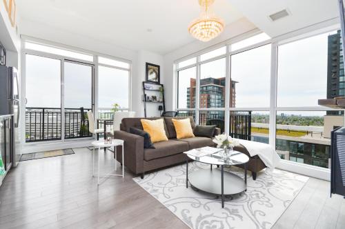 a living room with a couch and a table at The Splendid - Luxury 1BR Uptown Toronto in Toronto