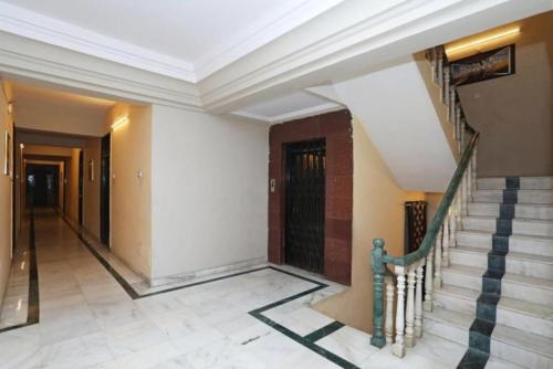 a staircase in a building with a white ceiling at Hotel Ace Plaza in Udaipur