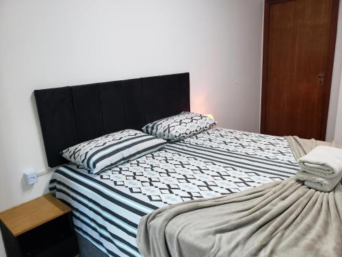 a bedroom with two beds with pillows on them at Pousada Monte Sião in Sao Paulo