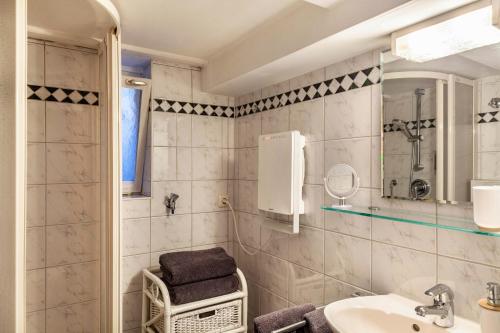 a bathroom with a sink and a mirror at Höllental 51 in Garmisch-Partenkirchen
