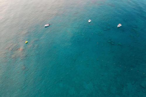 an overhead view of boats in the water at Labranda Kiotari Miraluna Resort in Kiotari