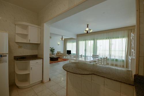 a kitchen with a large counter top in a room at Beach house First Row sea view at Santa Monica next to Almaza Bay in Marsa Matruh