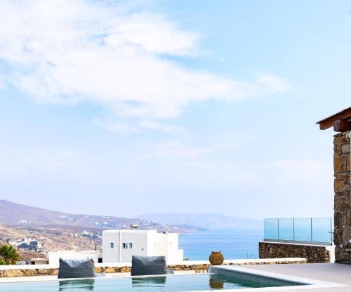 a view of the ocean from a villa with a swimming pool at Mykonian Luxury Ortus Villa with Private Pool in Kalafatis