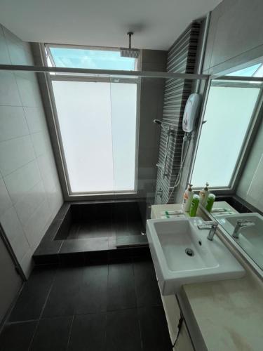 a bathroom with a sink and a large window at Good Mood House 3-7pax,Free Parking,upstairs Shopping Mall, Hospital Columbia, TAR University, LRT Station in Kuala Lumpur