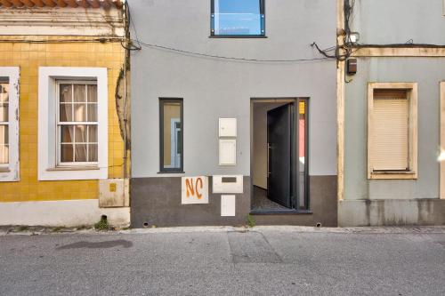 a door to a building with a no sign on it at Apartamento T1 - Salina Ria in Aveiro