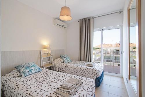 Ένα ή περισσότερα κρεβάτια σε δωμάτιο στο Costa Cabanas 36