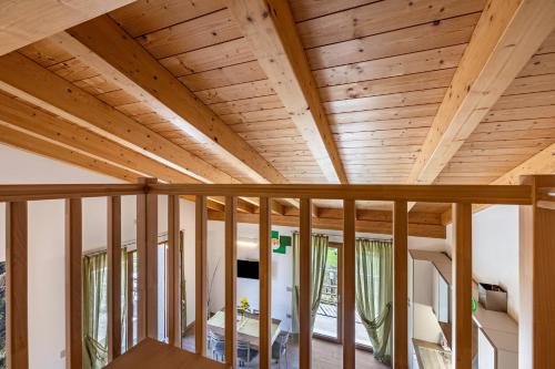 a wooden ceiling in a room with wooden beams at Agriturismo Bocca Nevese Pino in Tremosine Sul Garda