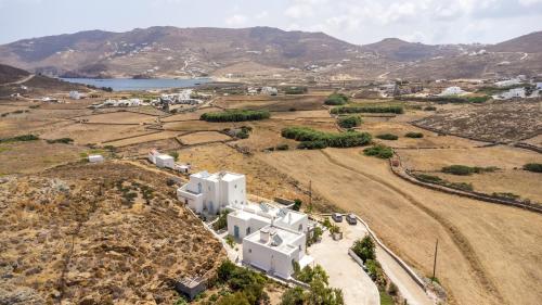 an aerial view of a white house on a hill at Afroditi Ftelia Yasemi b in Elia