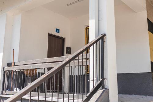a stairway in a building with a door at Downtown Apartment Travnik in Travnik