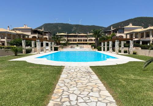 a swimming pool in the middle of a yard at Villa Myrto Nafpaktos in Nafpaktos