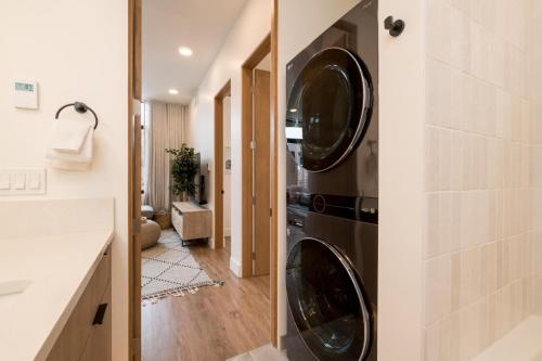 a kitchen with two washing machines in a wall at The Lofts 660 #203 in Ketchum