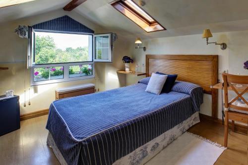 Cama o camas de una habitación en Hotel Mirador del Sella