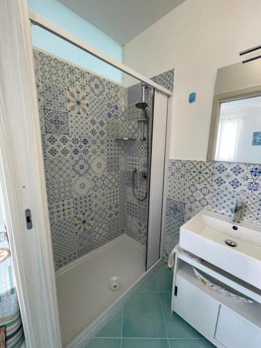 a bathroom with a shower and a sink at La casa di fronte la spiaggia di San Vito lo capo in San Vito lo Capo